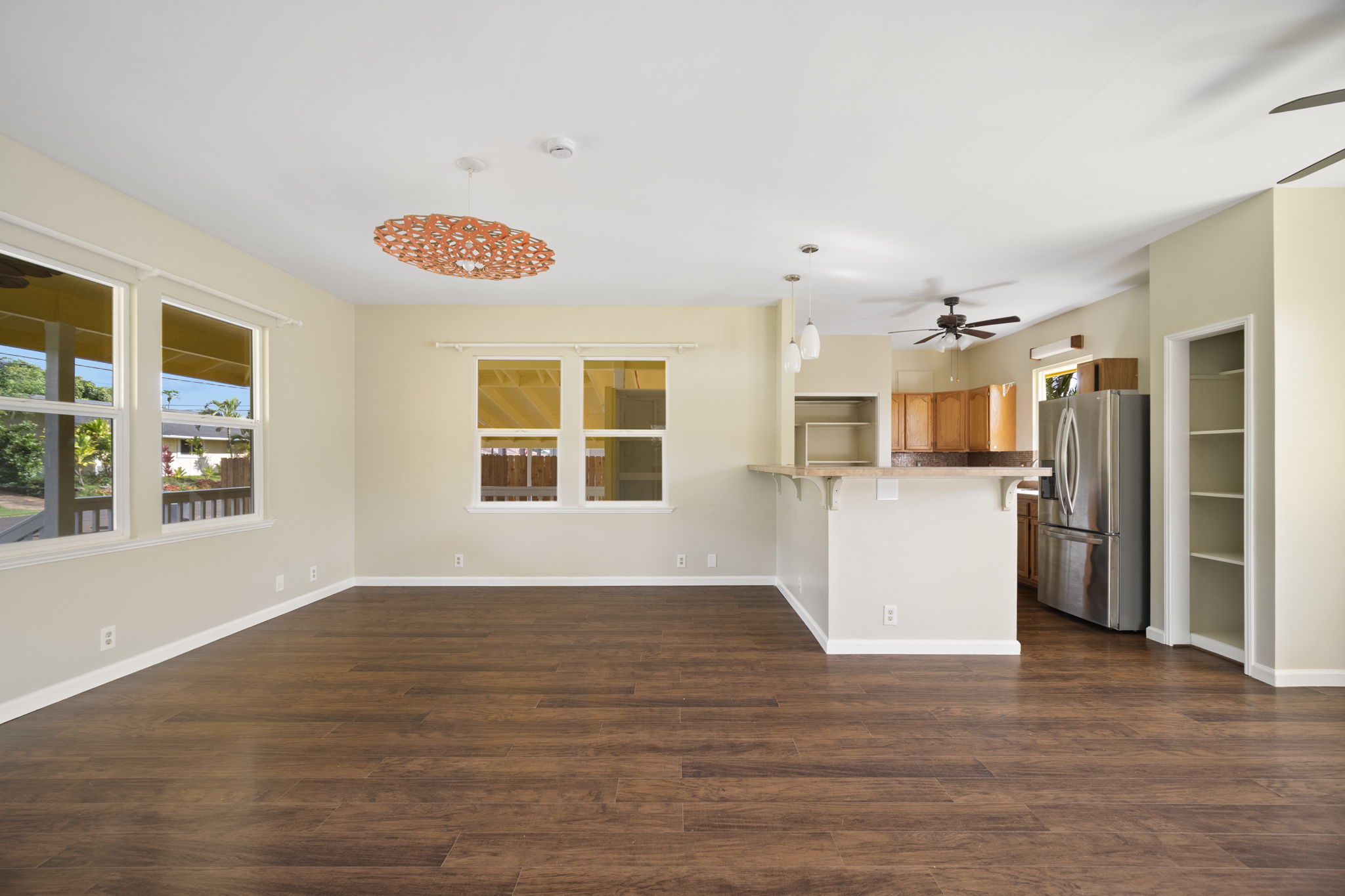 210 Eggerking Road Kapaa, HI 96746 - Photo 10 of 30 a view of a kitchen with furniture and wooden floor