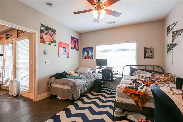 a bedroom with furniture and a window