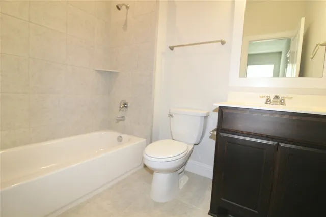 a bathroom with a sink toilet and bathtub