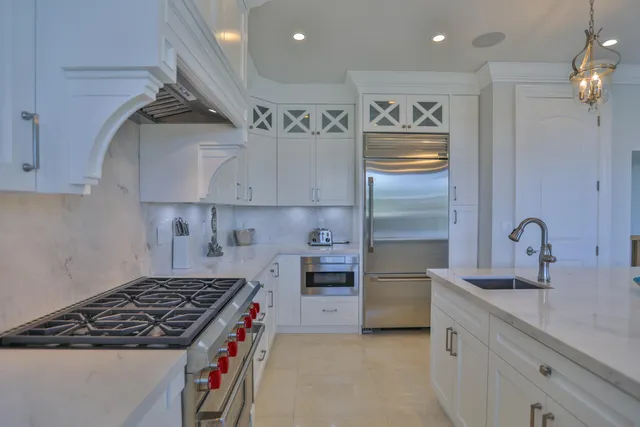 a view of a dining room with furniture a chandelier and wooden floor