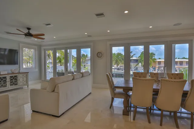 a bathroom with a toilet sink vanity and mirror