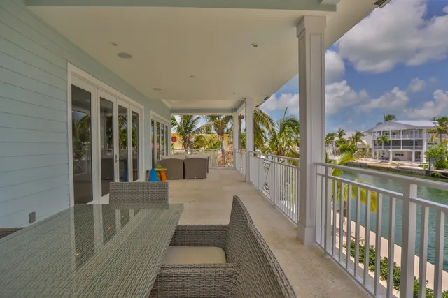a kitchen with counter top space and wooden floor