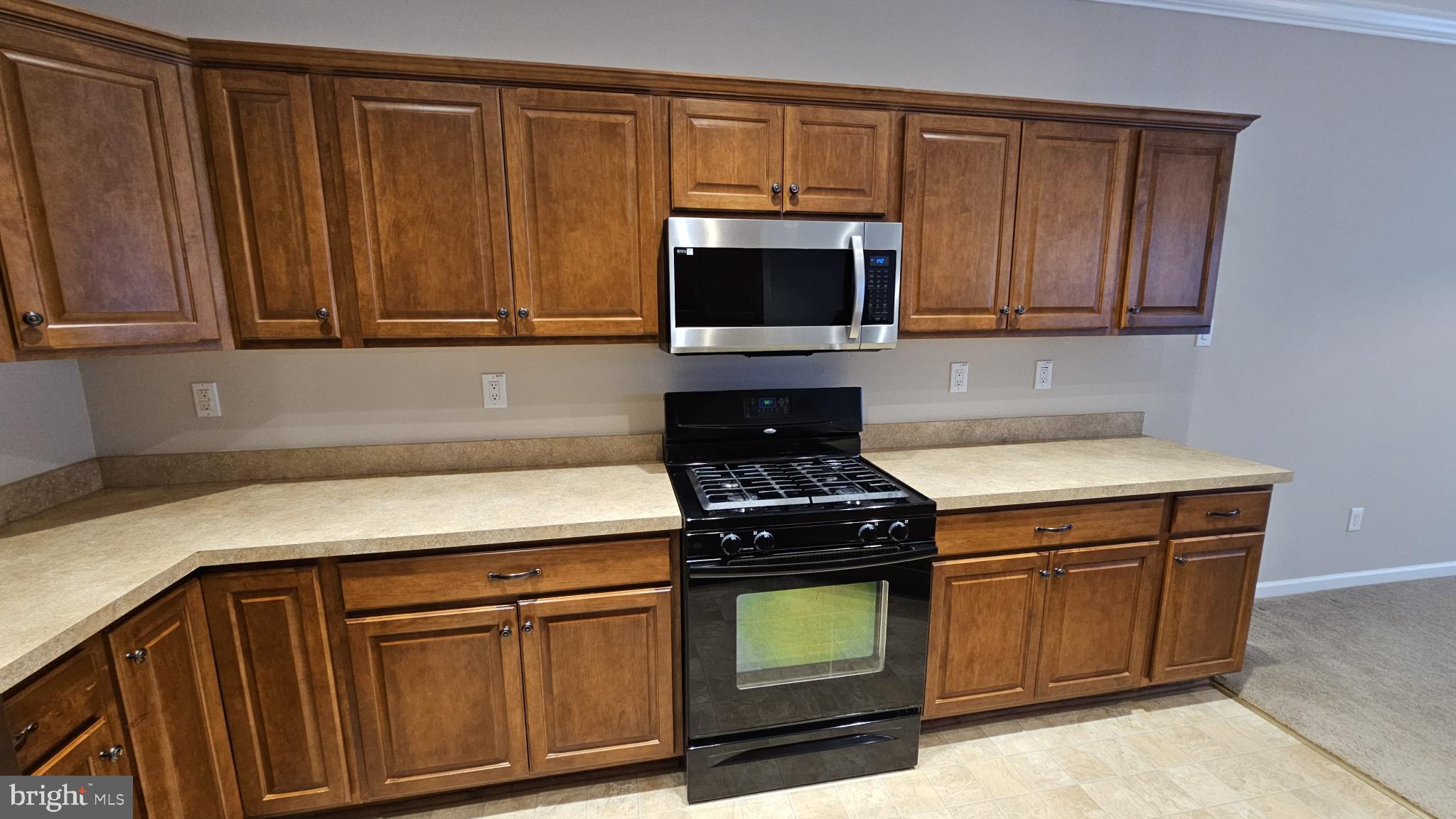 4079 Yorktown Road Coopersburg, PA 18036 - Photo 5 of 26 Modern kitchen with rich wood cabinetry.