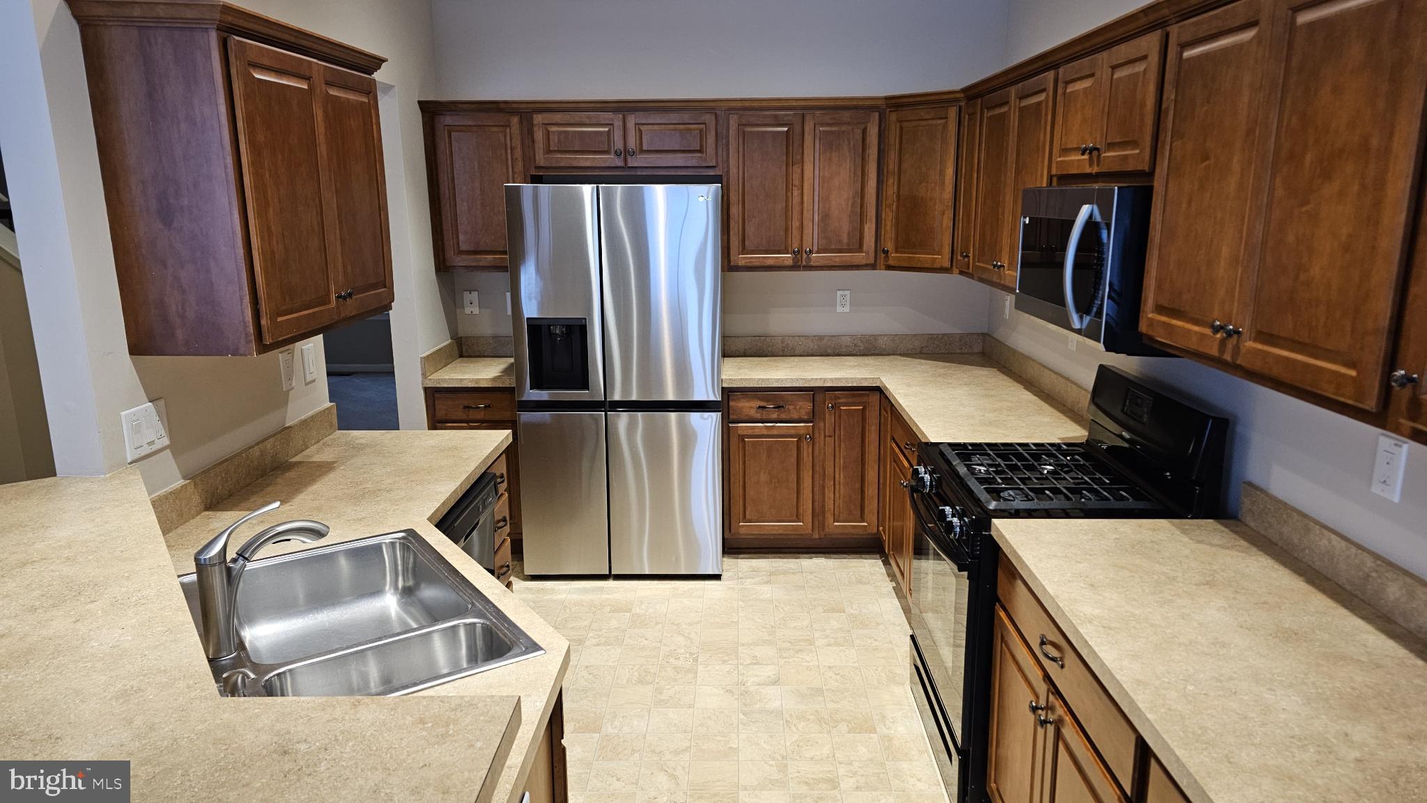 4079 Yorktown Road Coopersburg, PA 18036 - Photo 6 of 26 Modern kitchen with rich wood cabinetry.