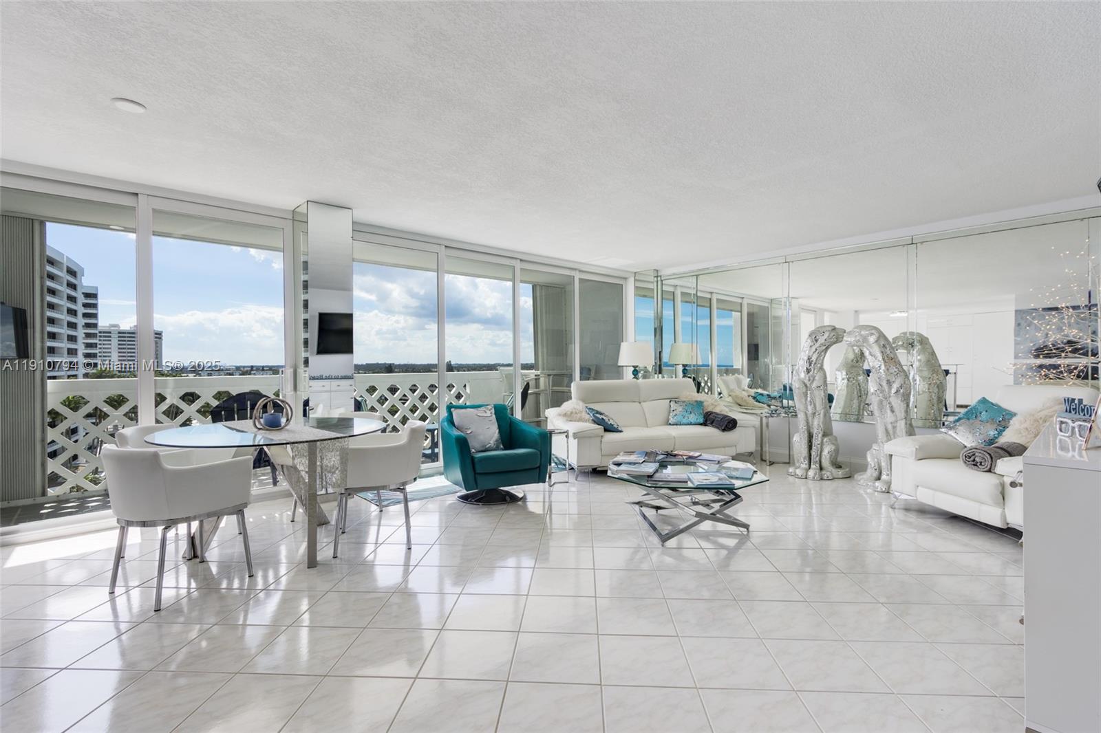 1200 South Ocean Boulevard, Unit 9F Boca Raton, FL 33432 - Photo 11 of 55 a living room with furniture and a large window