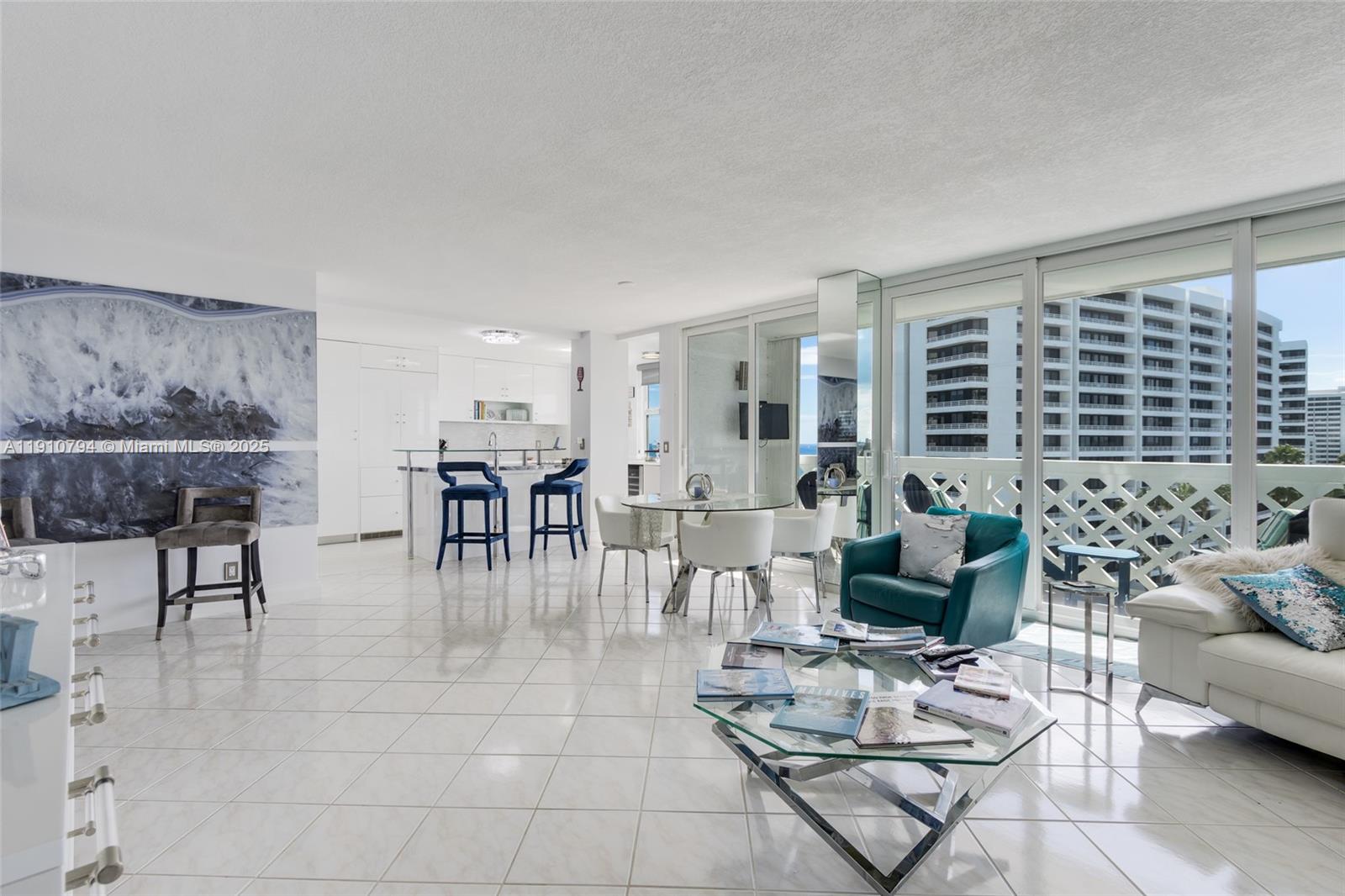 1200 South Ocean Boulevard, Unit 9F Boca Raton, FL 33432 - Photo 12 of 55 a living room with furniture a dining table and a potted plant