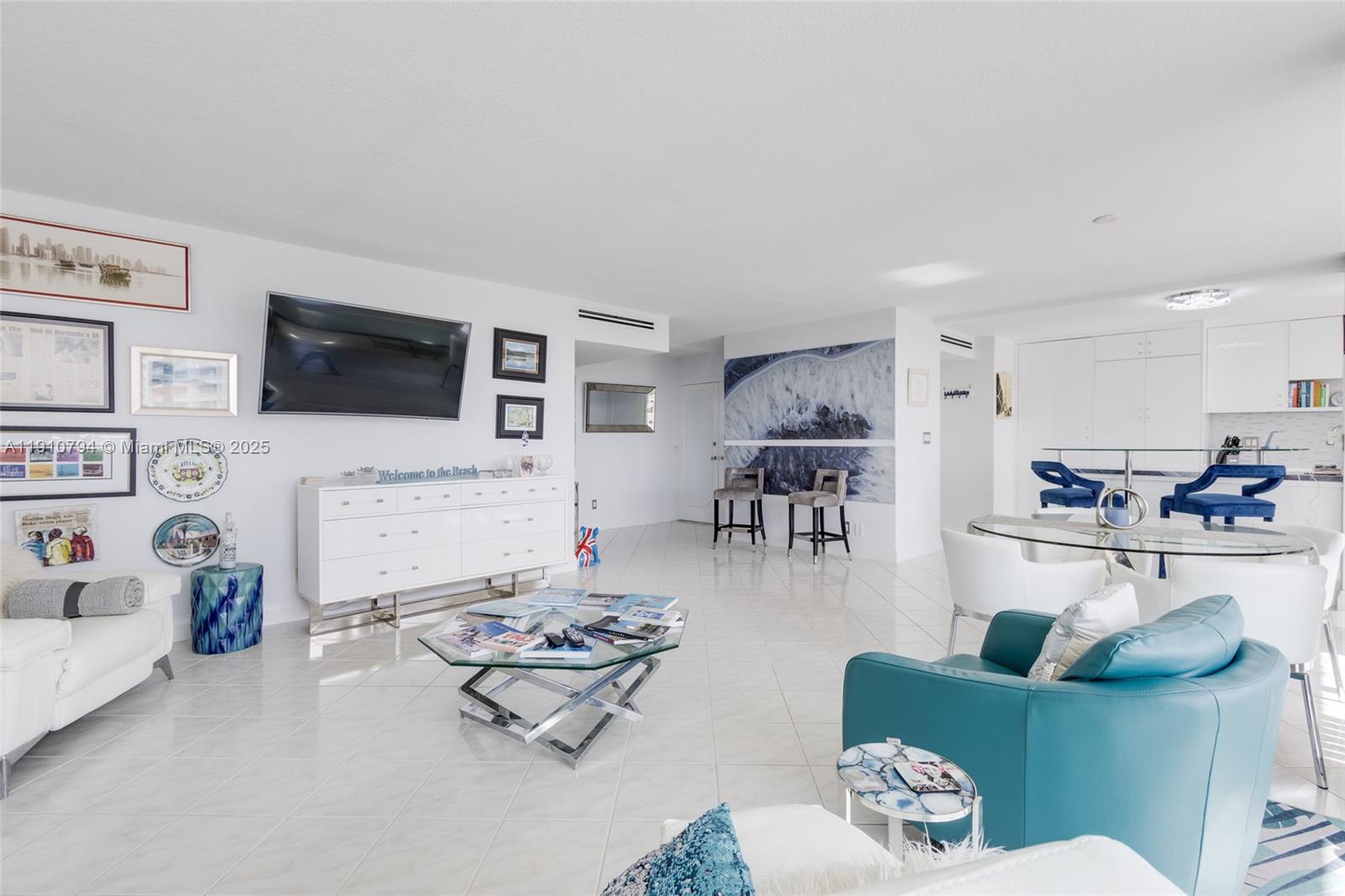 1200 South Ocean Boulevard, Unit 9F Boca Raton, FL 33432 - Photo 13 of 55 a living room with furniture and a flat screen tv