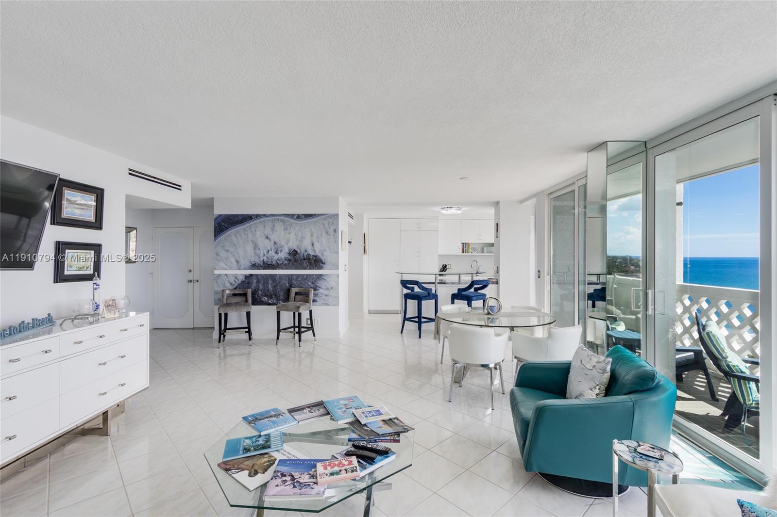 1200 South Ocean Boulevard, Unit 9F Boca Raton, FL 33432 - Photo 14 of 55 a living room with furniture and a large window