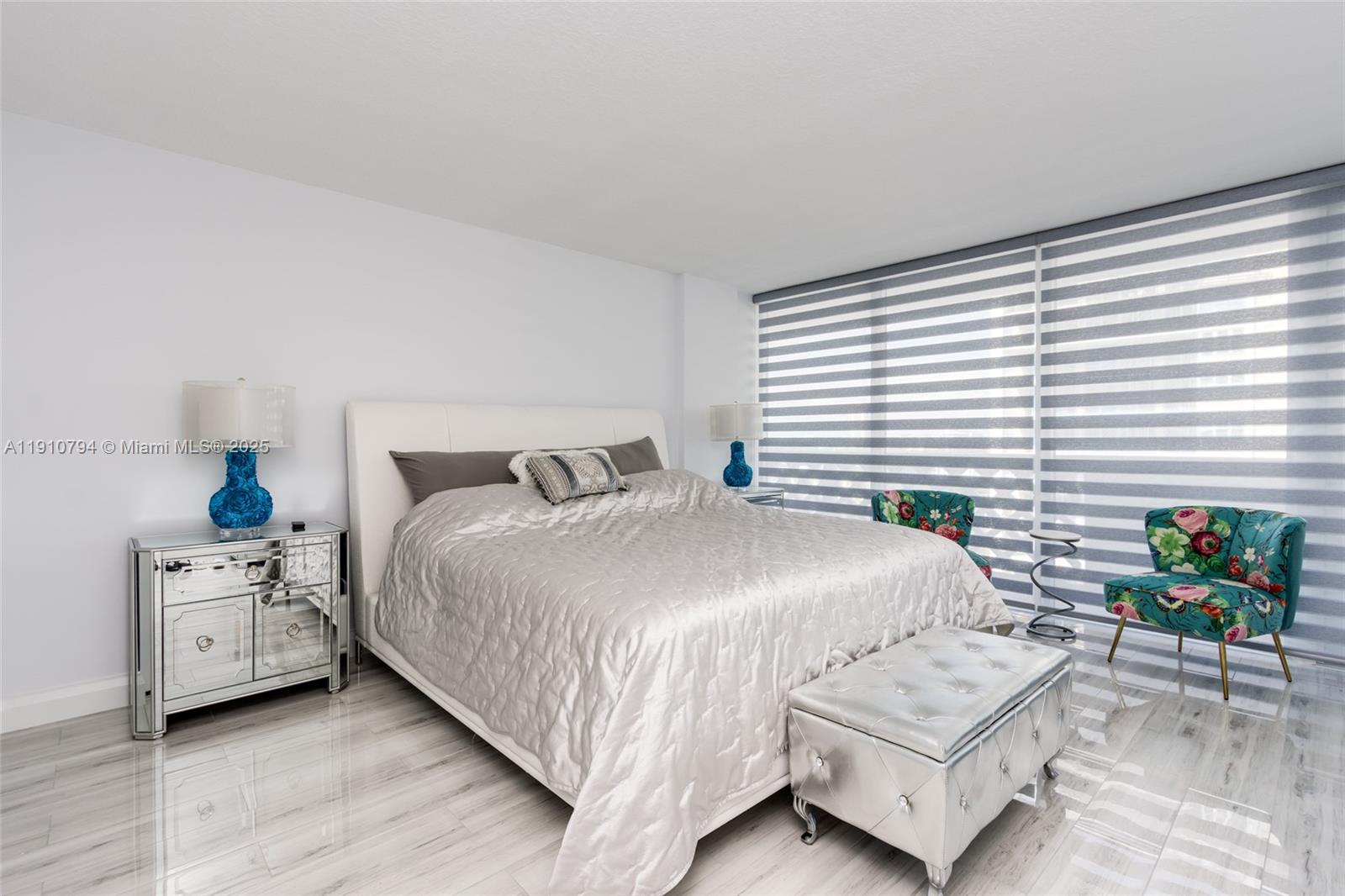 1200 South Ocean Boulevard, Unit 9F Boca Raton, FL 33432 - Photo 15 of 55 a bedroom with a bed table chair and window