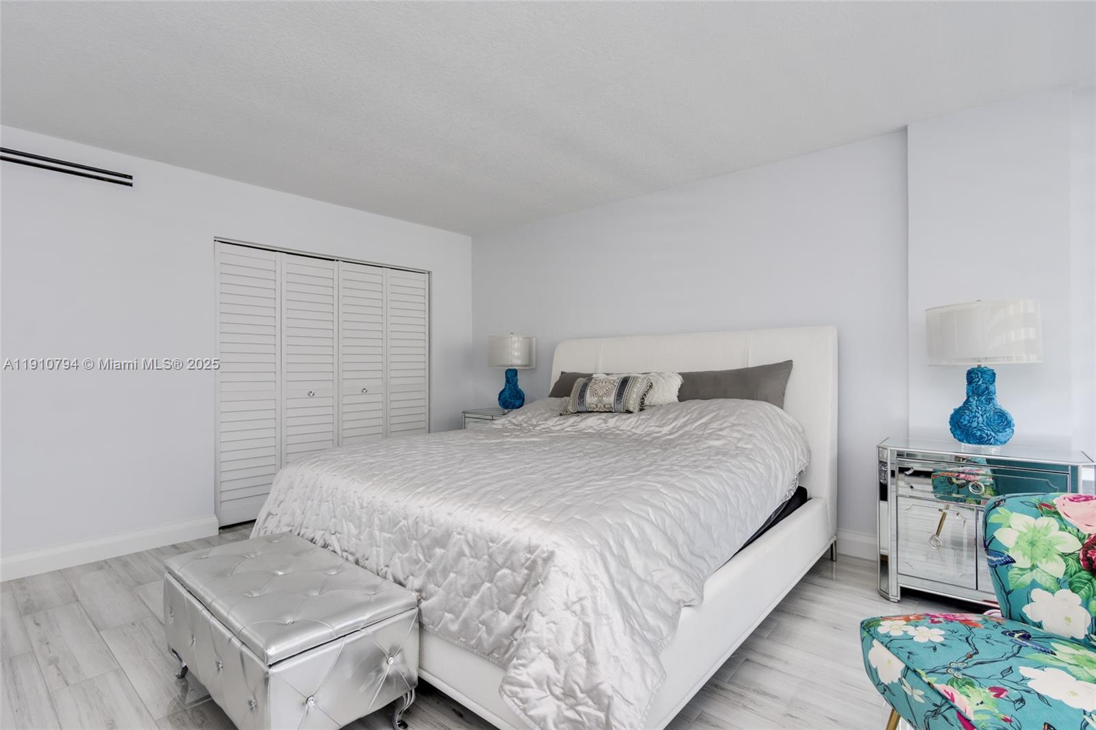 1200 South Ocean Boulevard, Unit 9F Boca Raton, FL 33432 - Photo 16 of 55 a bedroom with a bed and a table in it