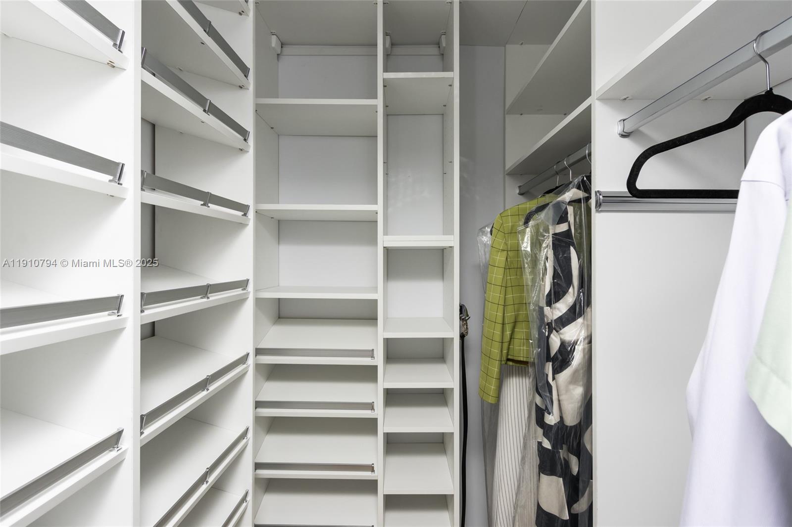 1200 South Ocean Boulevard, Unit 9F Boca Raton, FL 33432 - Photo 19 of 55 a view of walk in closet with empty racks