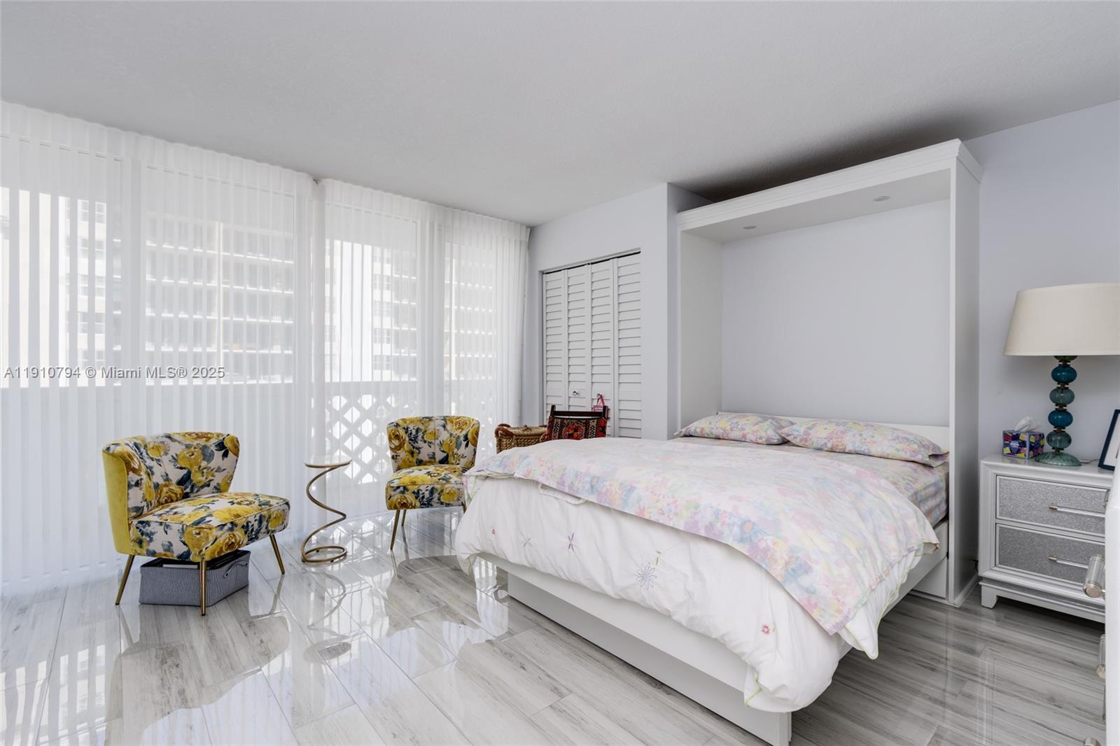 1200 South Ocean Boulevard, Unit 9F Boca Raton, FL 33432 - Photo 22 of 55 a bedroom with a bed and a couch