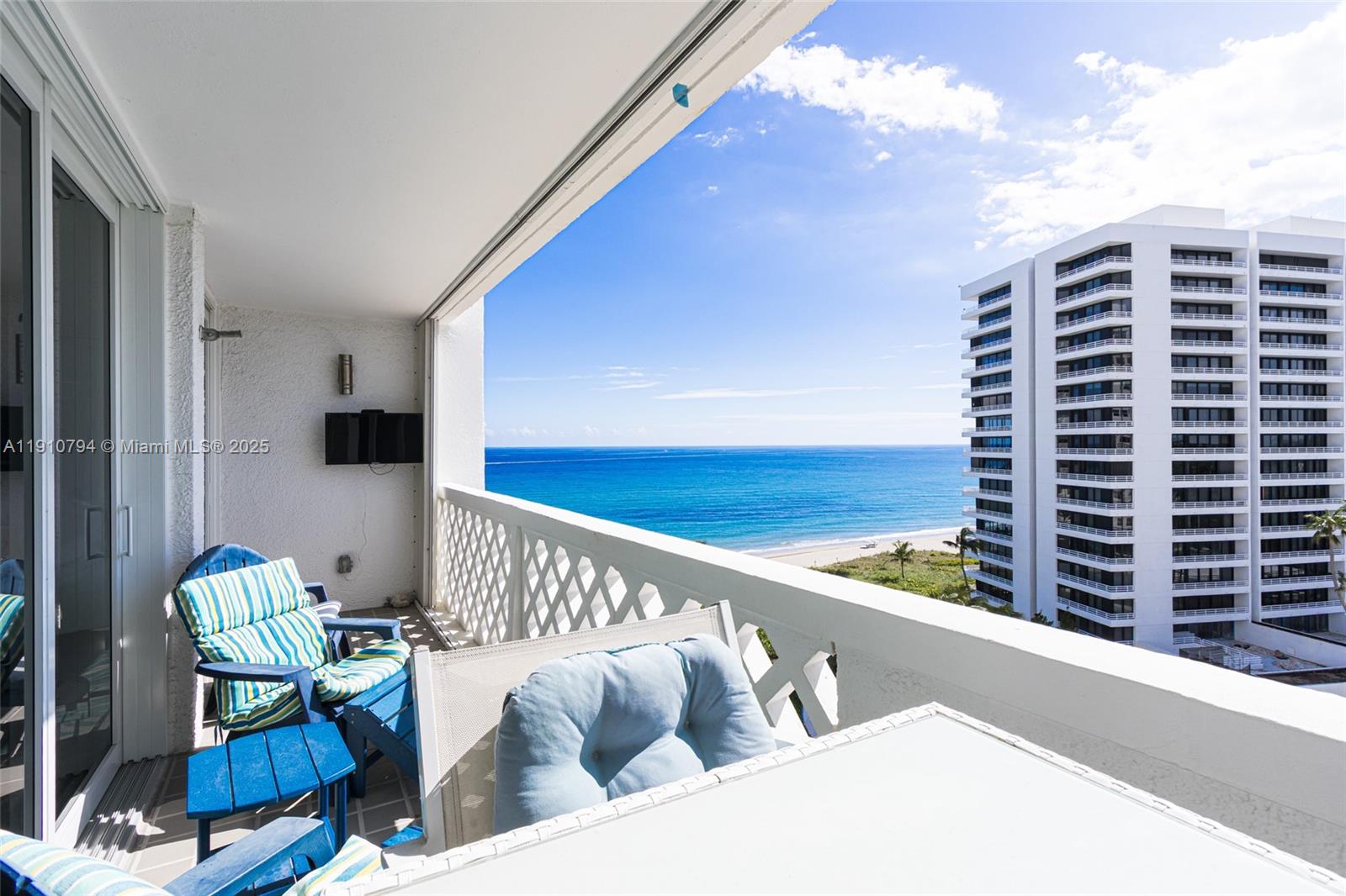 1200 South Ocean Boulevard, Unit 9F Boca Raton, FL 33432 - Photo 31 of 55 a view of balcony with two chairs and a couch