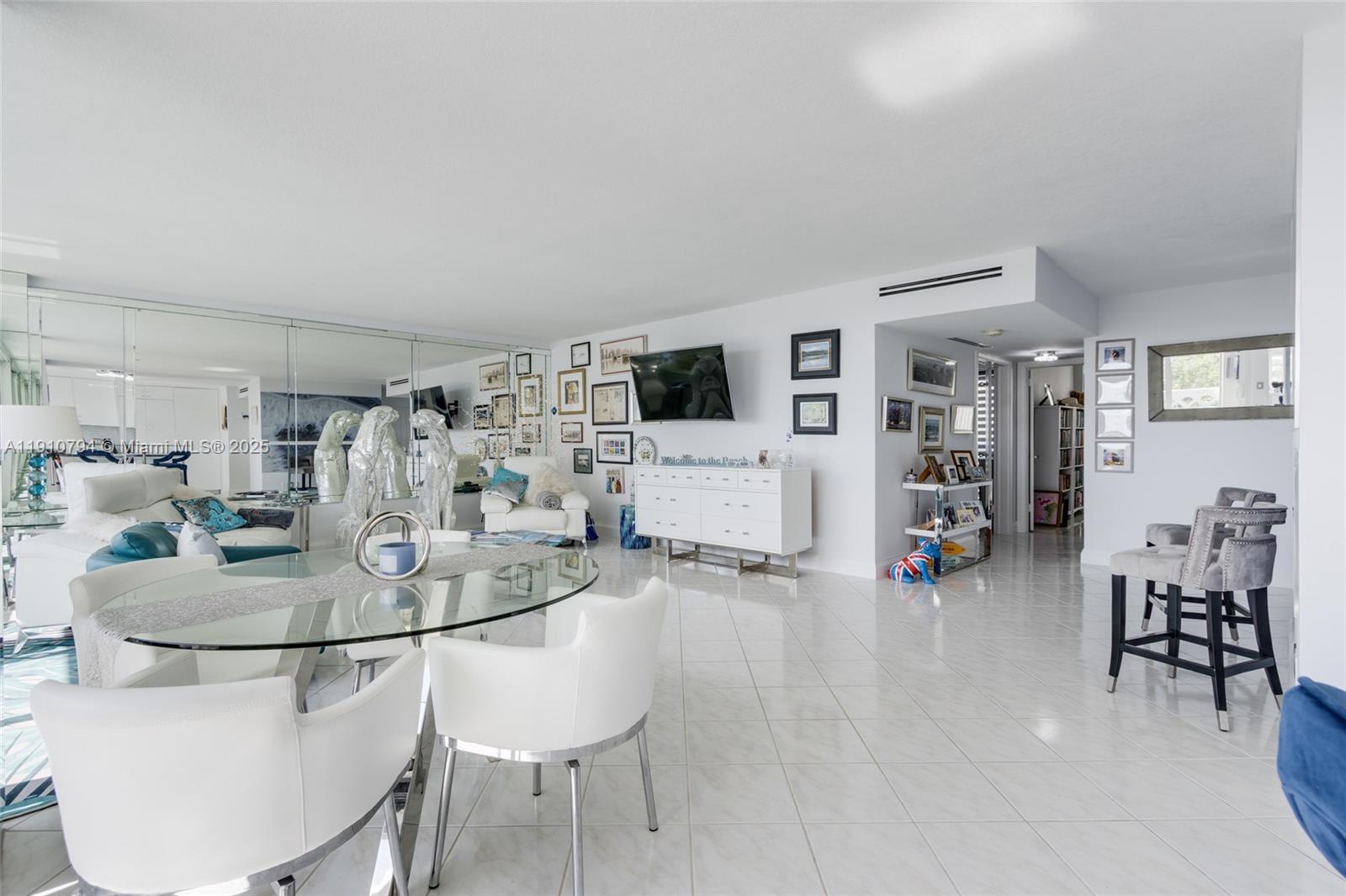 1200 South Ocean Boulevard, Unit 9F Boca Raton, FL 33432 - Photo 9 of 55 a dining room with furniture and wooden floor