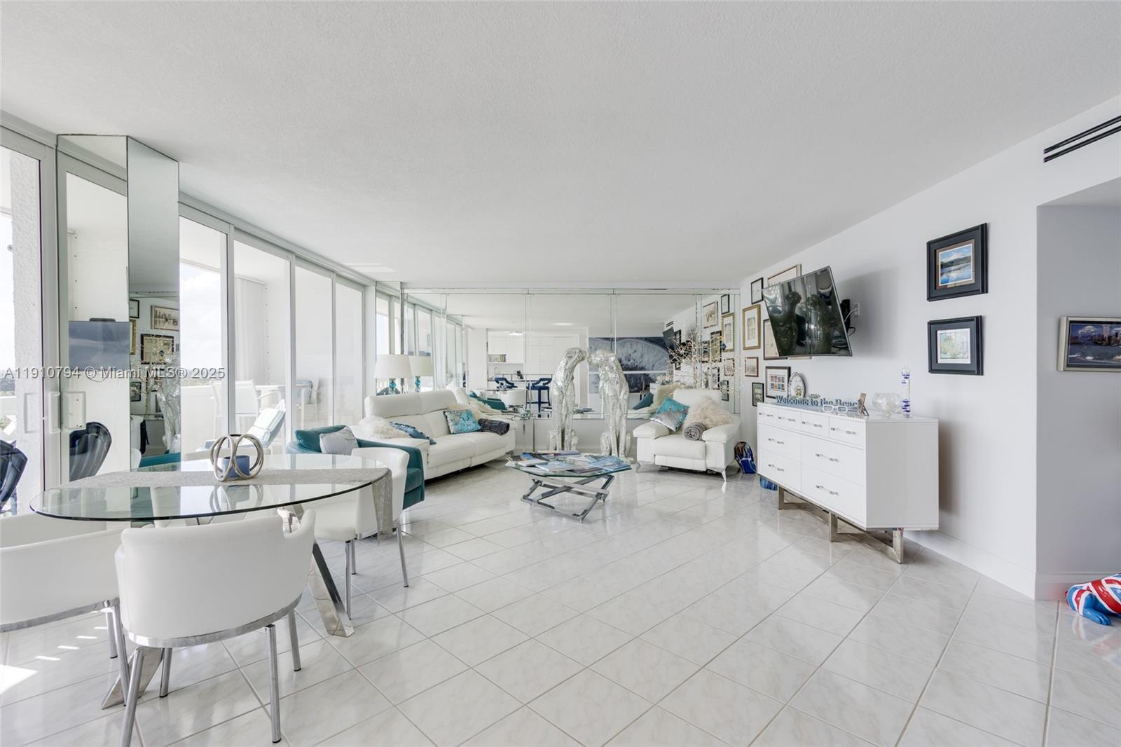1200 South Ocean Boulevard, Unit 9F Boca Raton, FL 33432 - Photo 10 of 55 a living room with furniture and a large window