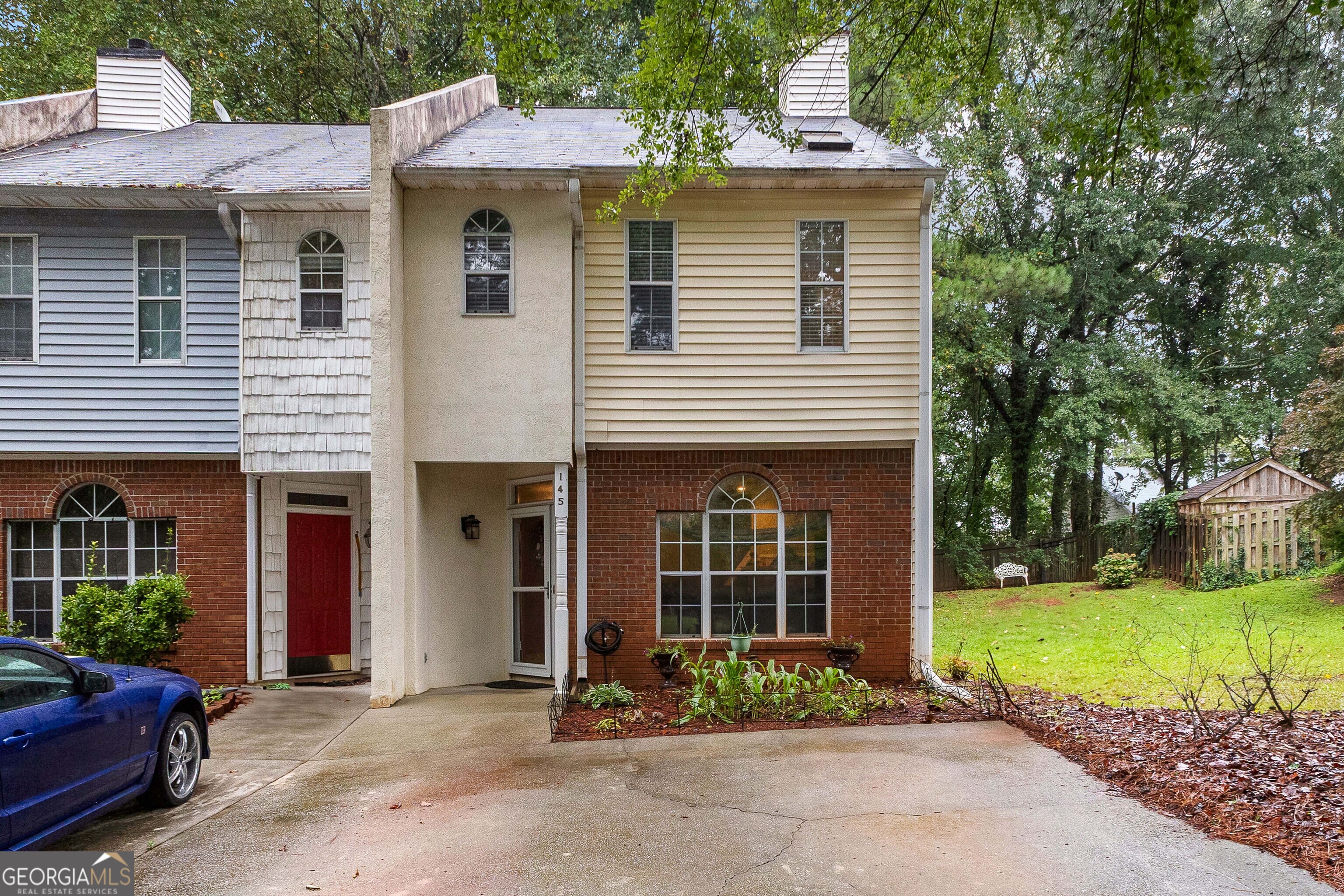 a front view of a house with garden