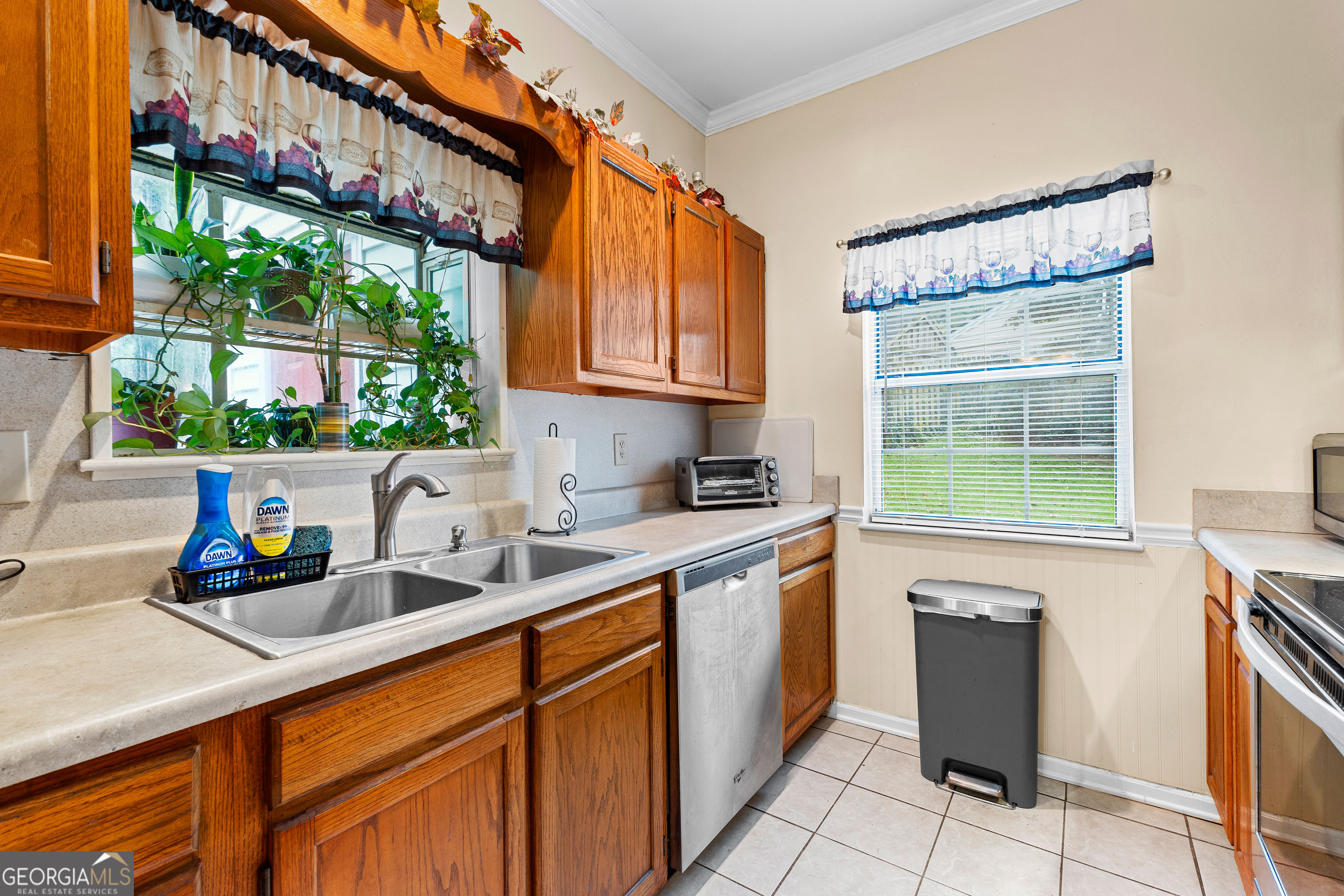 145 Greison Trail Newnan, GA 30263 - Photo 11 of 28 a kitchen with a sink cabinets and window