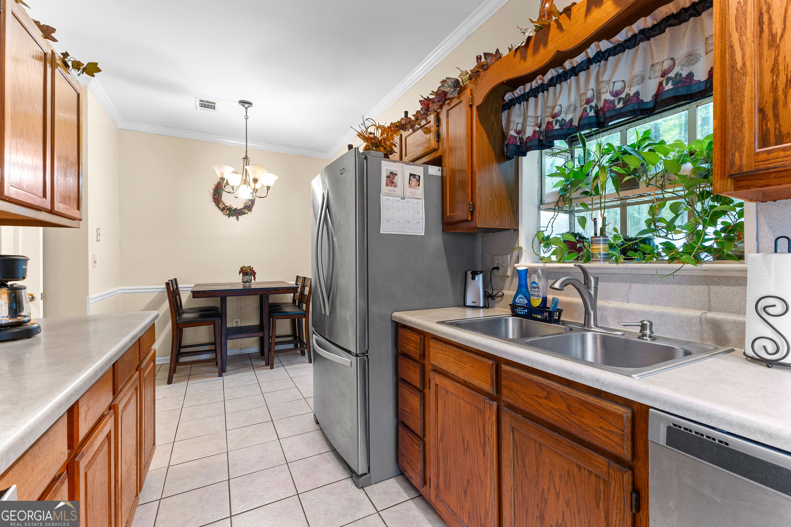145 Greison Trail Newnan, GA 30263 - Photo 12 of 28 a kitchen with a sink and cabinets
