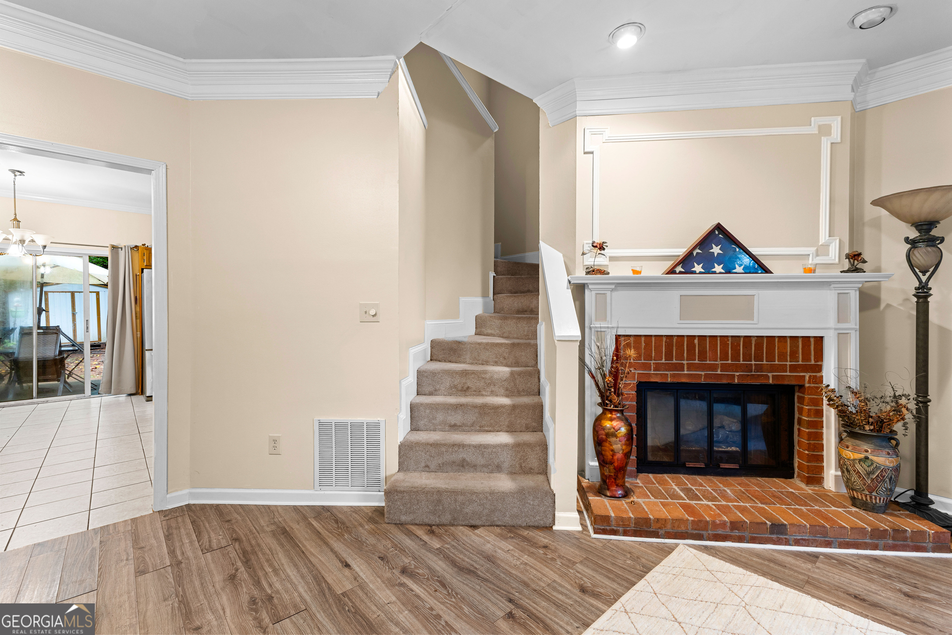145 Greison Trail Newnan, GA 30263 - Photo 13 of 28 a living room with furniture and a fireplace