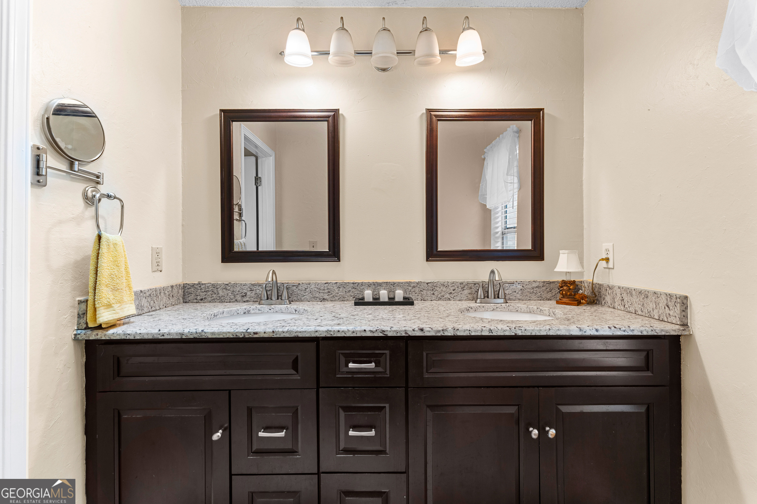 145 Greison Trail Newnan, GA 30263 - Photo 17 of 28 a bathroom with a granite countertop sink and a mirror