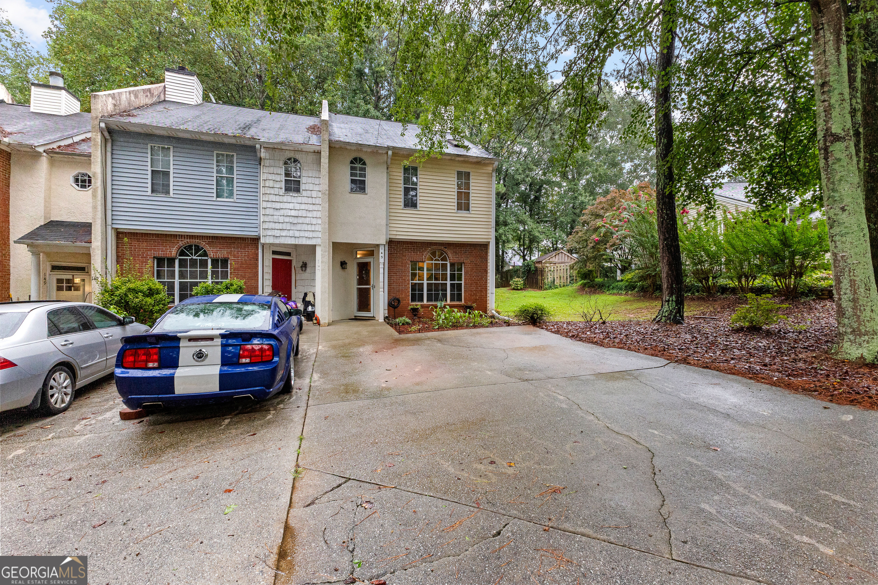145 Greison Trail Newnan, GA 30263 - Photo 24 of 28 a car parked in front of a house