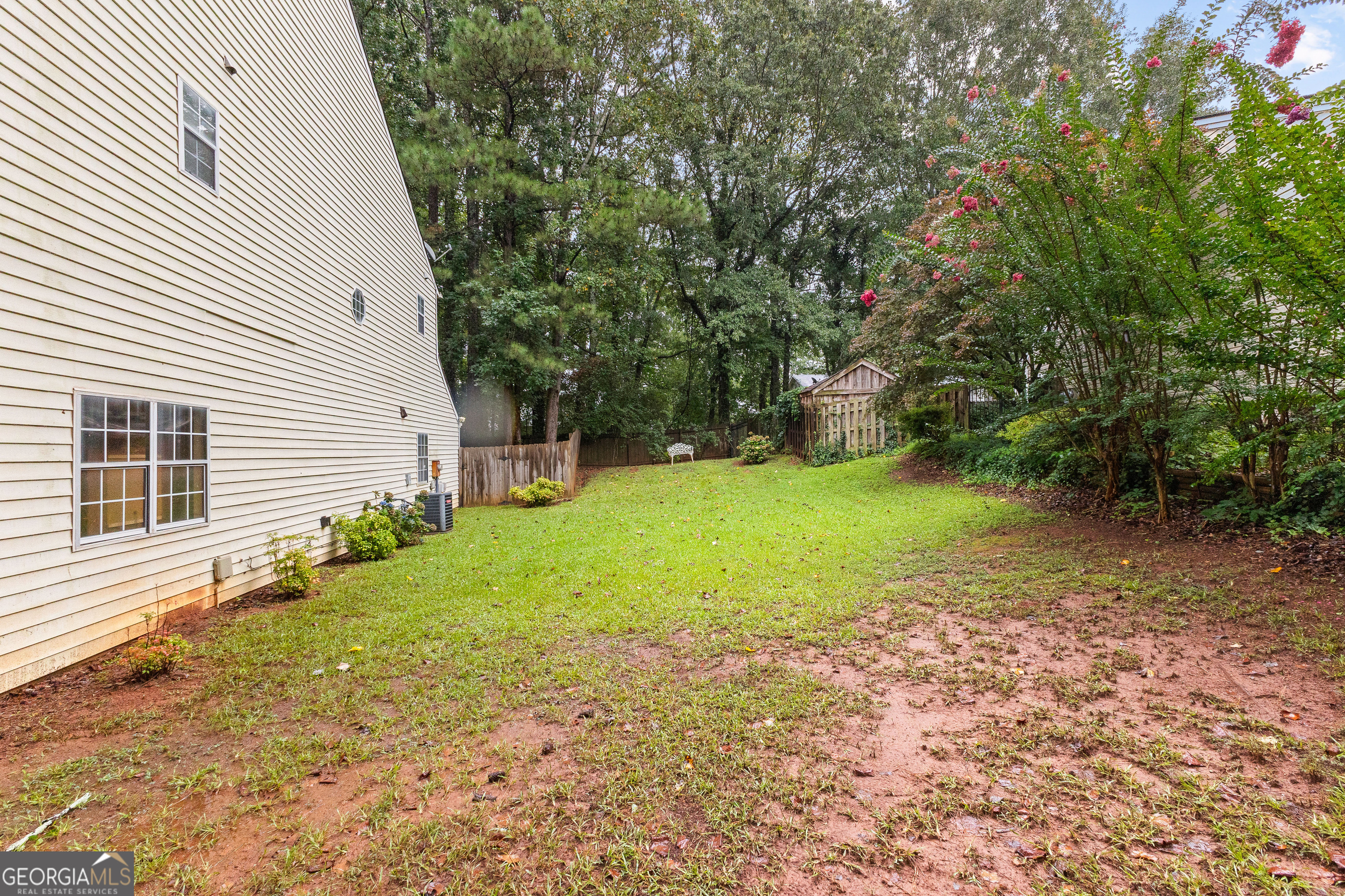 145 Greison Trail Newnan, GA 30263 - Photo 25 of 28 a view of a backyard with a garden