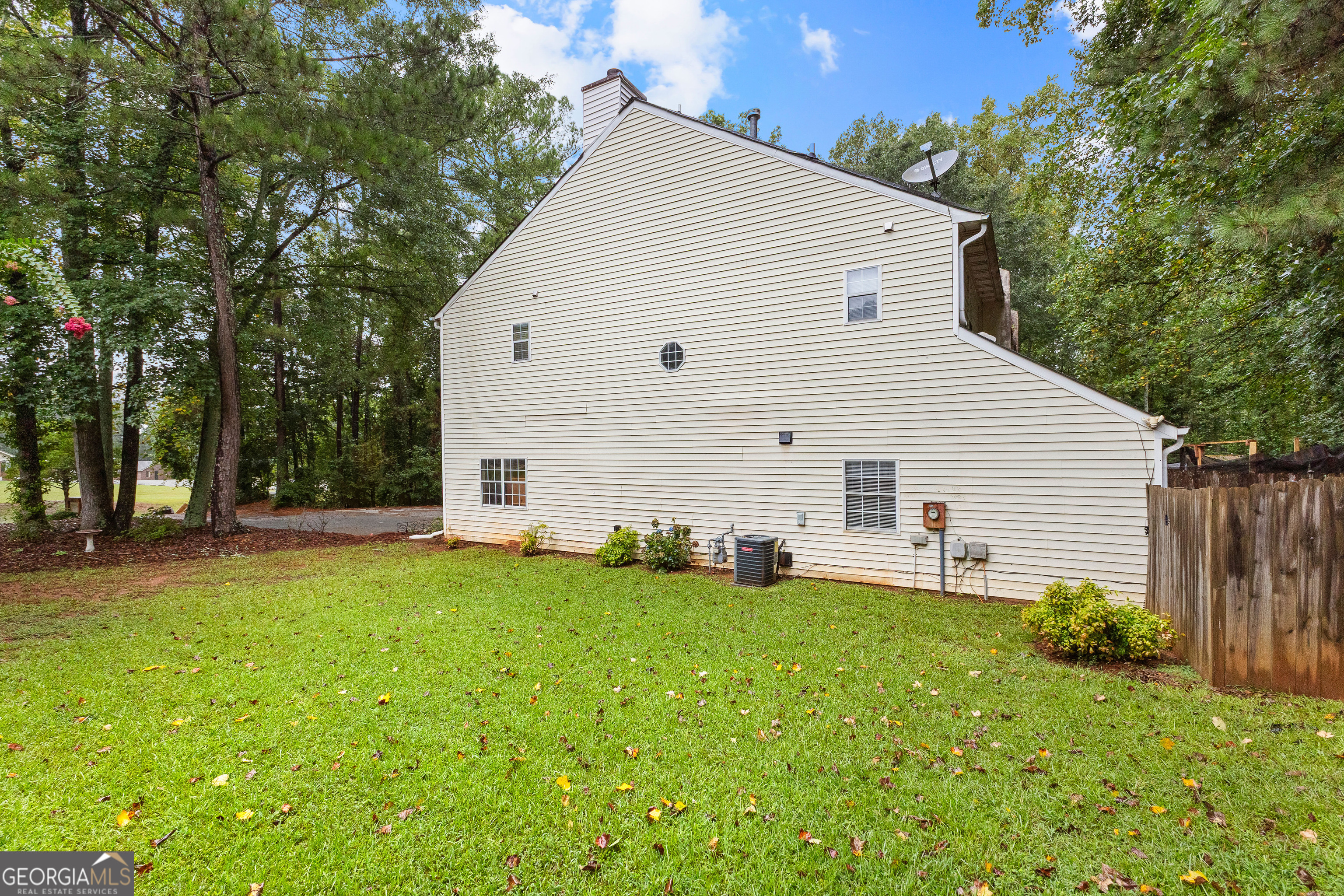 145 Greison Trail Newnan, GA 30263 - Photo 26 of 28 a view of a house with backyard