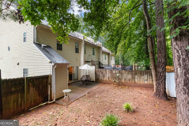 a backyard of a house with lots of water fountain