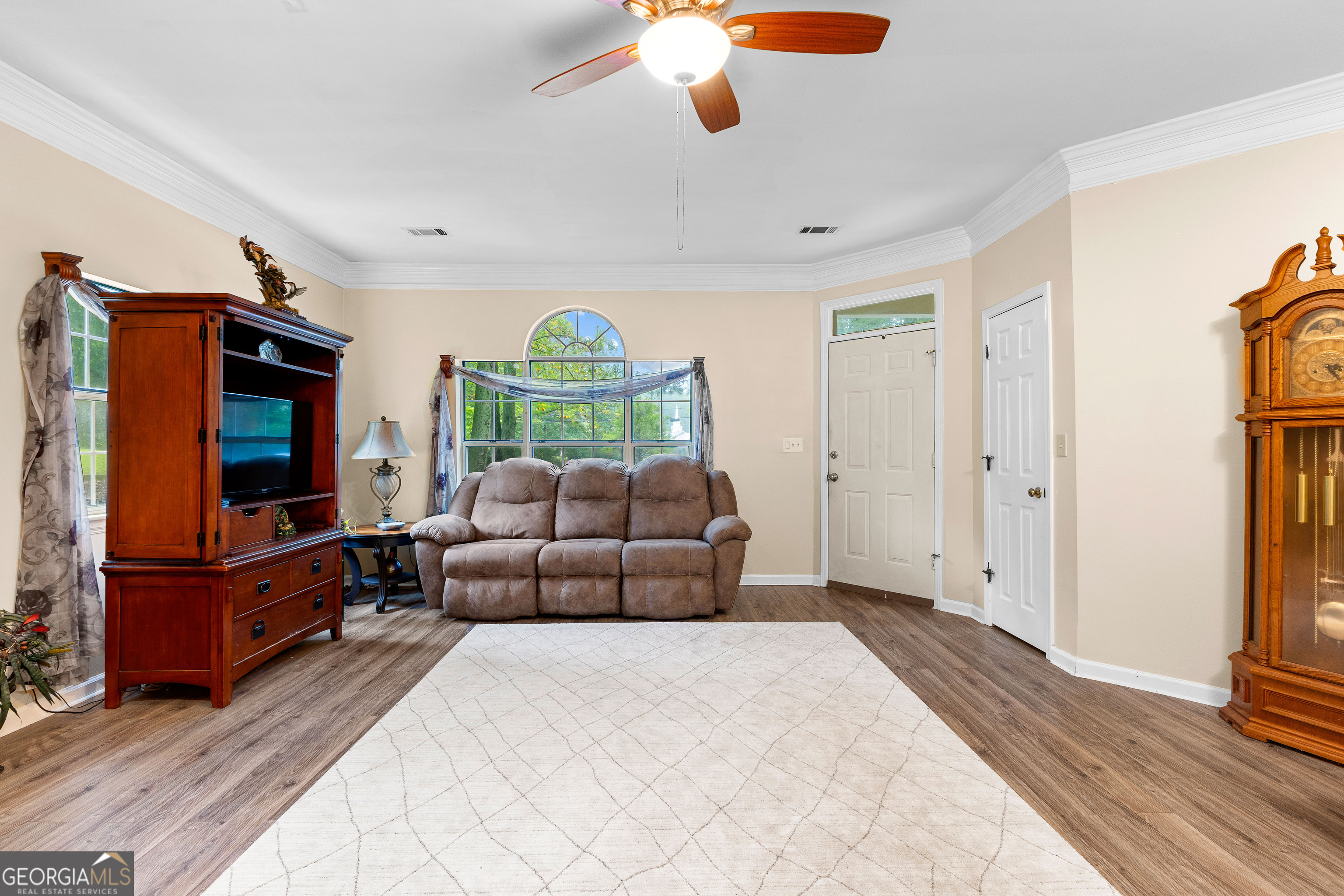 145 Greison Trail Newnan, GA 30263 - Photo 4 of 28 a living room with furniture and a flat screen tv