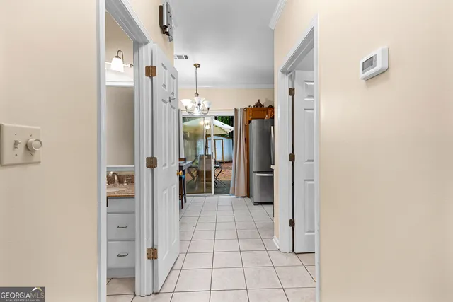 a view of a hallway with a living room