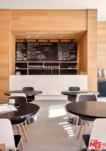 a room with a wooden floor and shelf