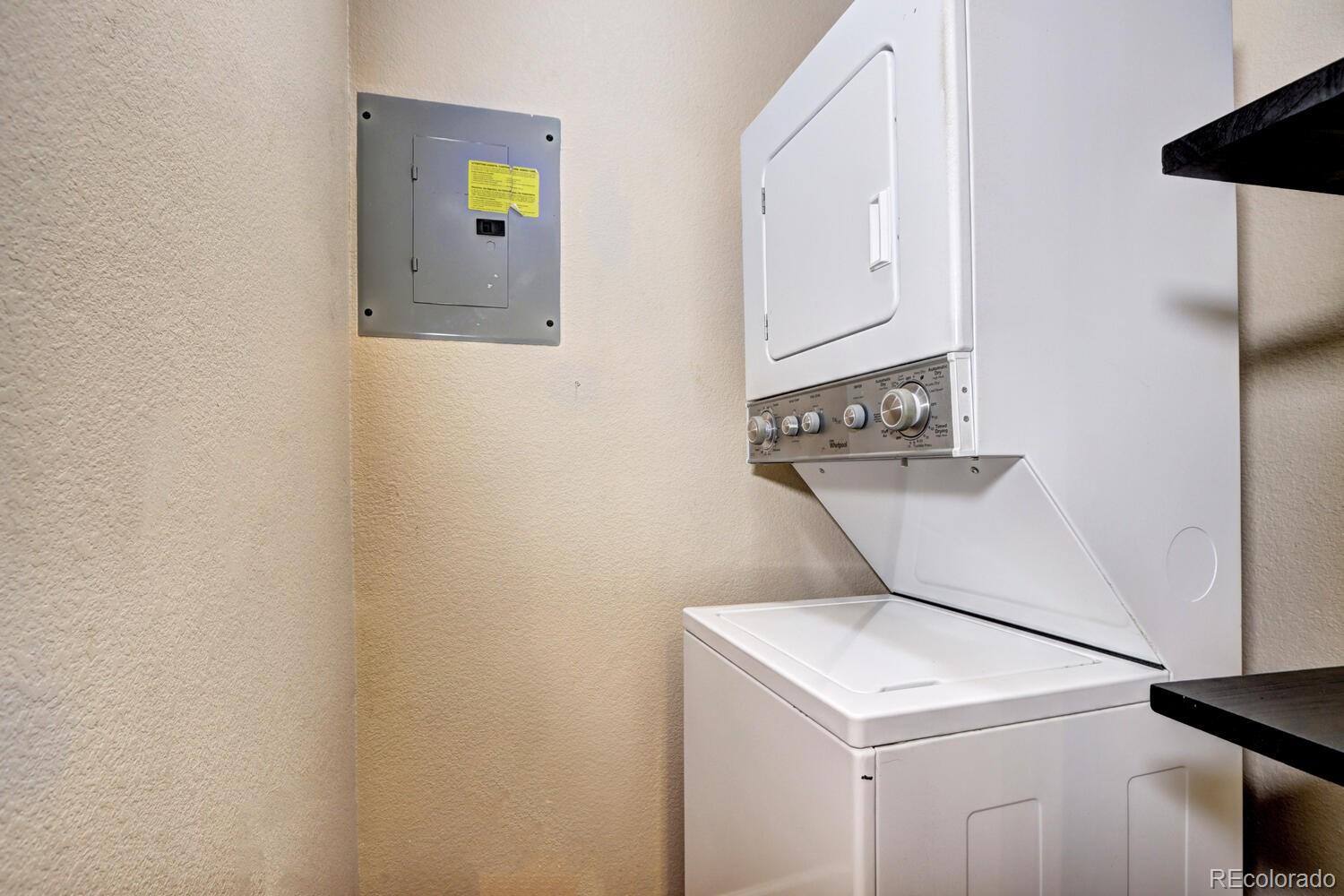 8707 East Florida Avenue, Unit 304 Denver, CO 80247 - Photo 14 of 26 a utility room with dryer and washer
