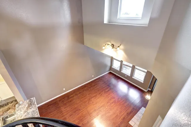 a view of an entryway with wooden floor