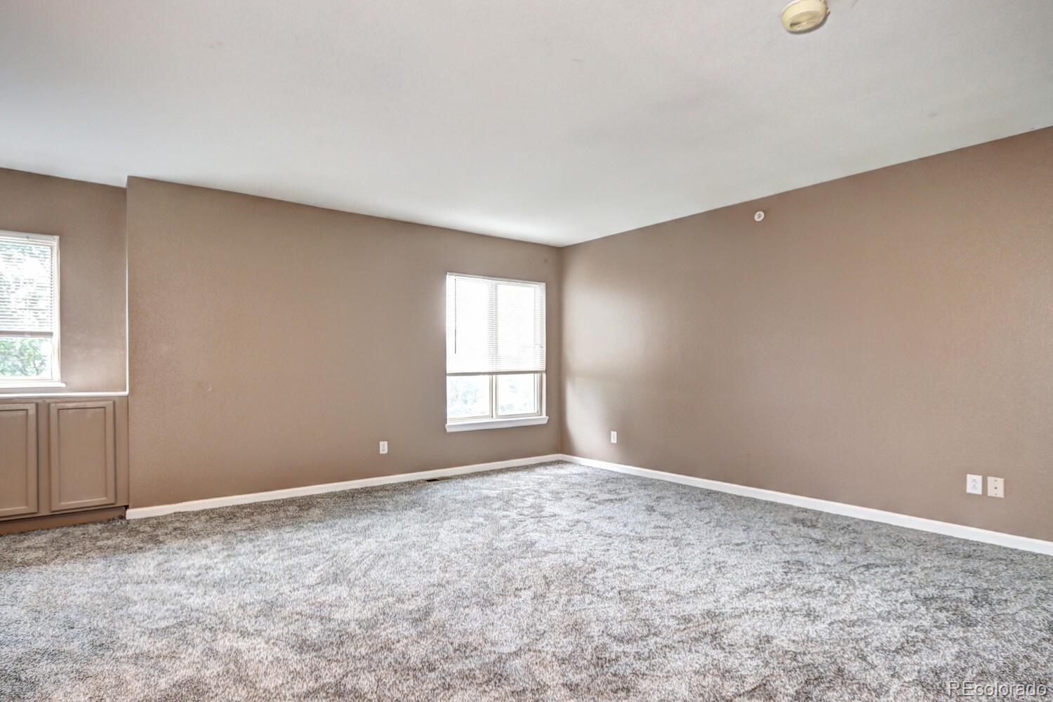 8707 East Florida Avenue, Unit 304 Denver, CO 80247 - Photo 20 of 26 a view of an empty room with a window