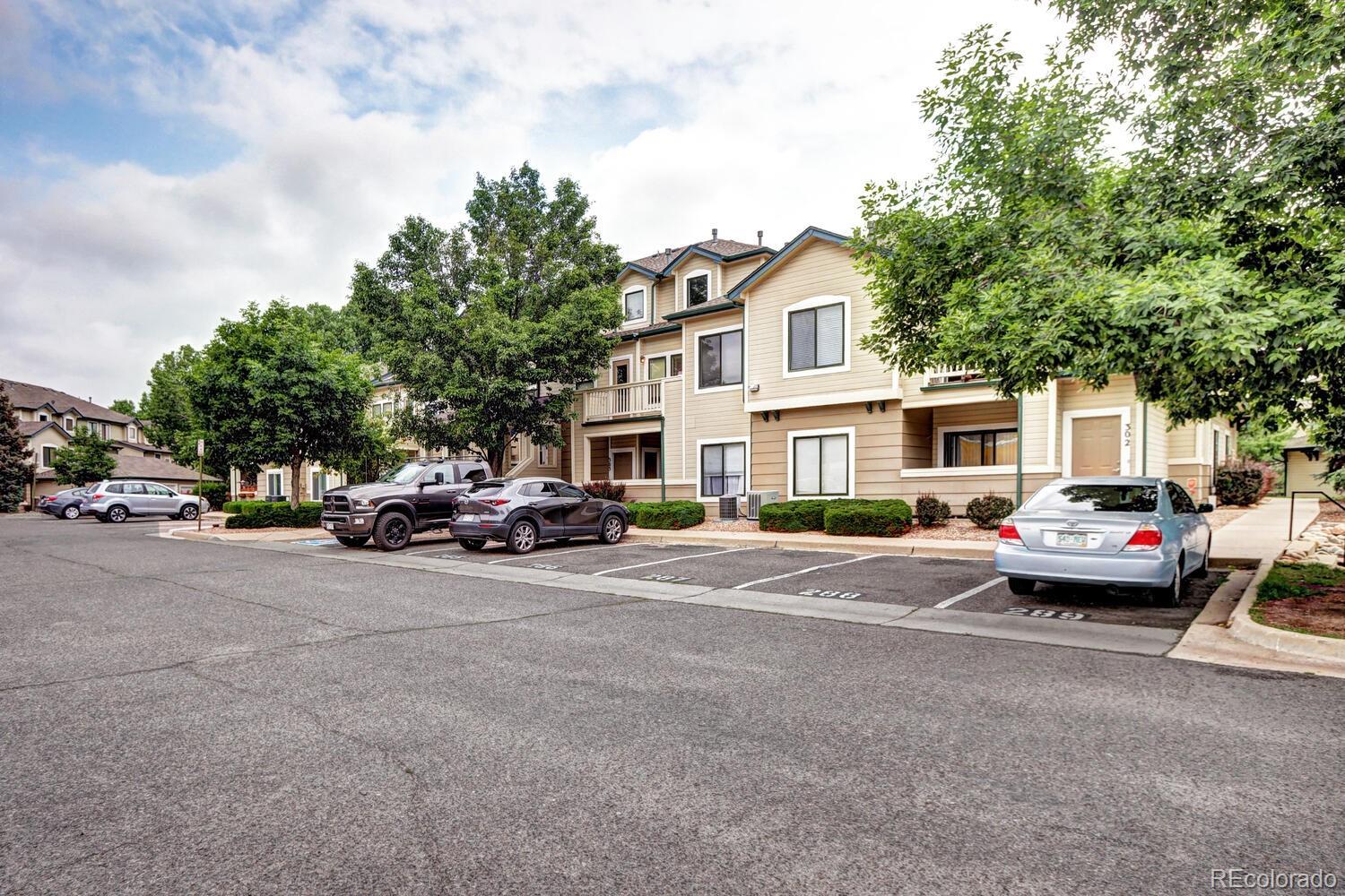 8707 East Florida Avenue, Unit 304 Denver, CO 80247 - Photo 26 of 26 a view of a street with cars