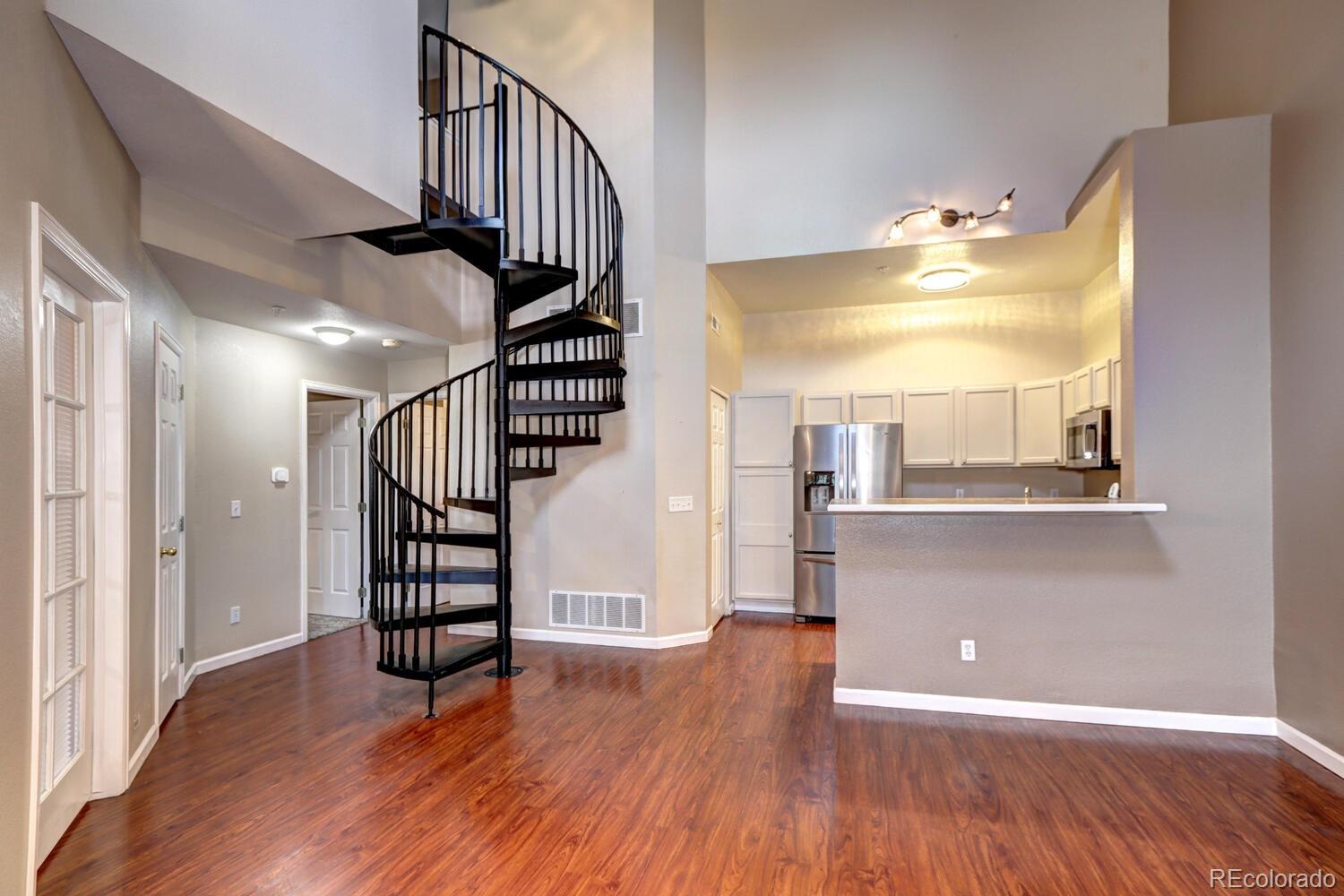 8707 East Florida Avenue, Unit 304 Denver, CO 80247 - Photo 10 of 26 a view of entryway and hall with wooden floor