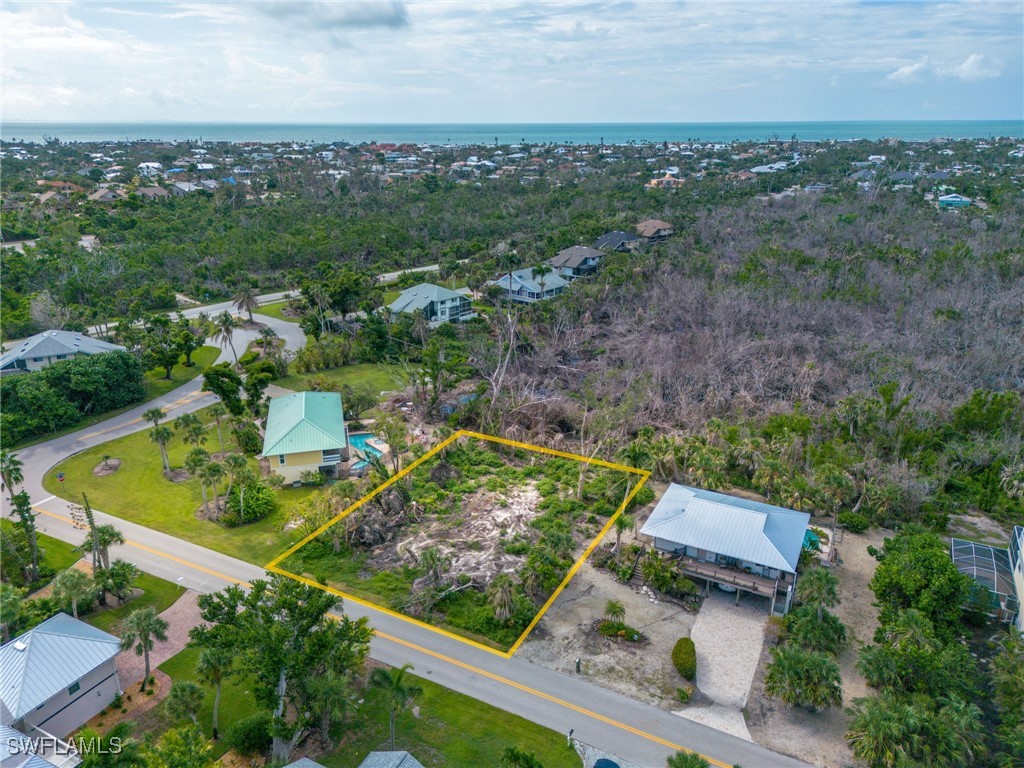 1032 Sand Castle Road Sanibel, FL 33957 - Photo 11 of 15 an aerial view of a residential houses with outdoor space and trees
