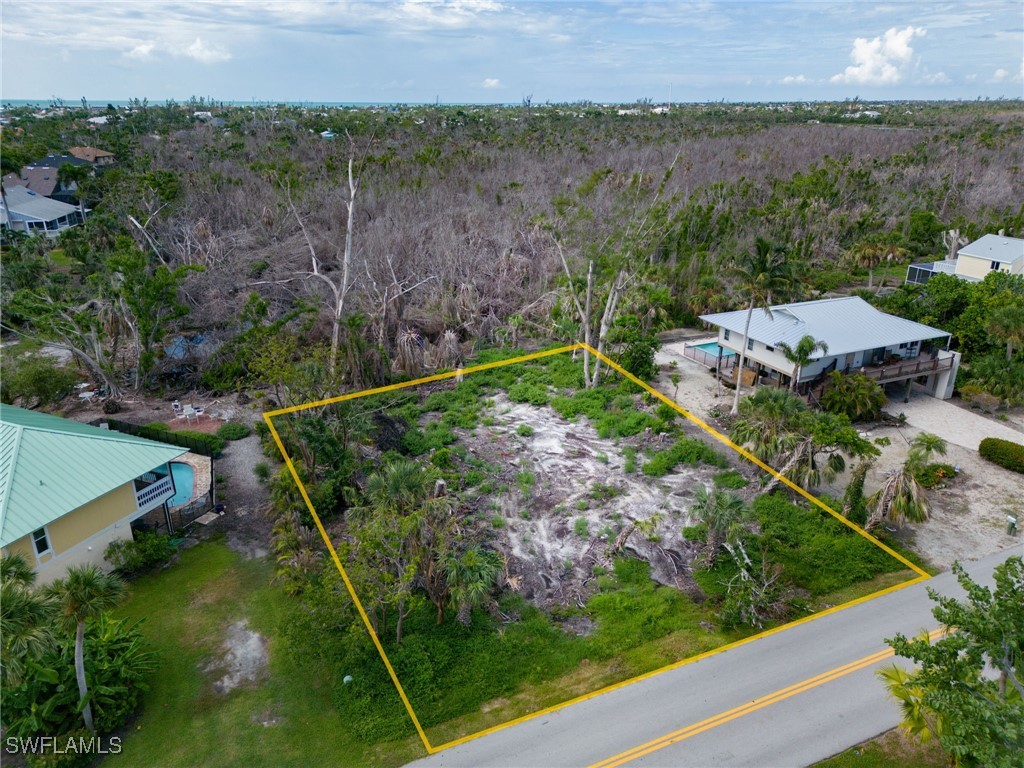 1032 Sand Castle Road Sanibel, FL 33957 - Photo 13 of 15 an aerial view of a house with a yard