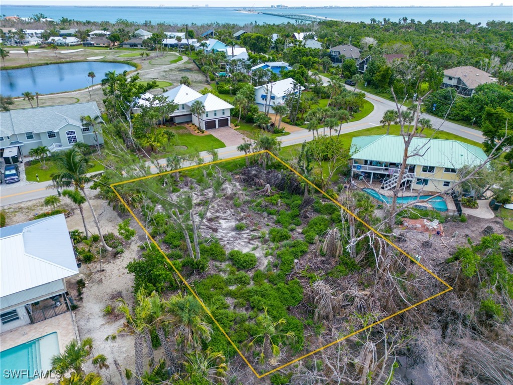 1032 Sand Castle Road Sanibel, FL 33957 - Photo 14 of 15 an aerial view of a houses with a yard