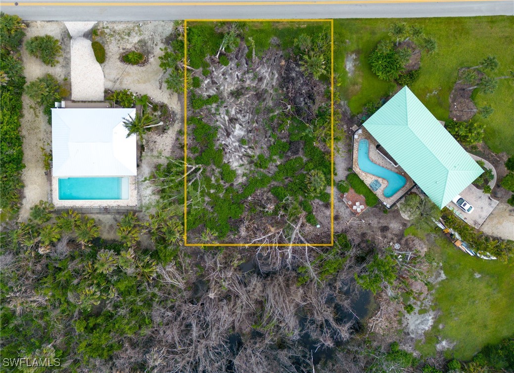 1032 Sand Castle Road Sanibel, FL 33957 - Photo 15 of 15 a view of a house with a yard