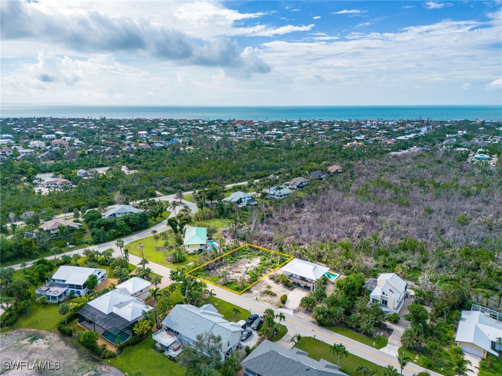 1032 Sand Castle Road Sanibel, FL 33957 - Photo 4 of 15 an aerial view of residential houses with outdoor space