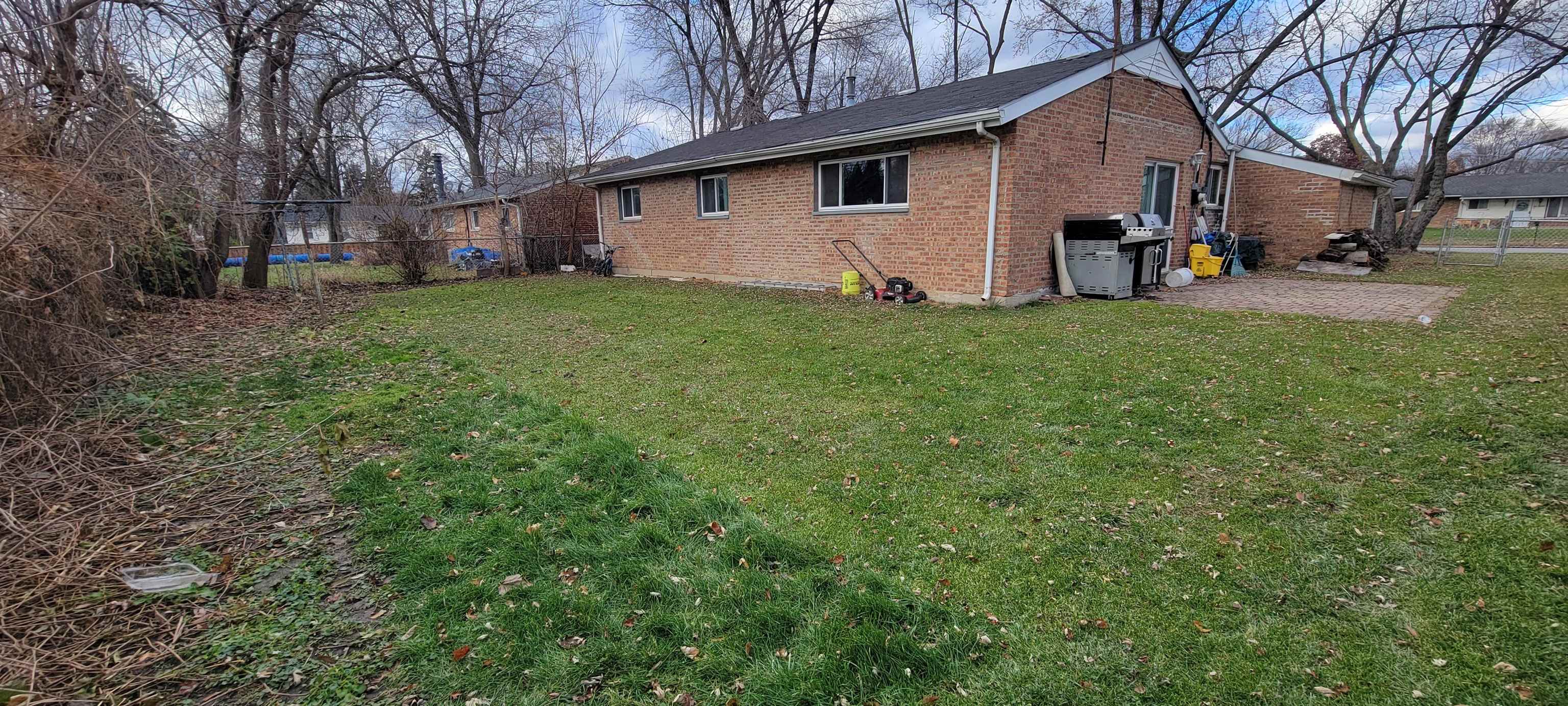 177 West Briarcliff Road Bolingbrook, IL 60440 - Photo 18 of 20 a view of a yard with a house and a yard