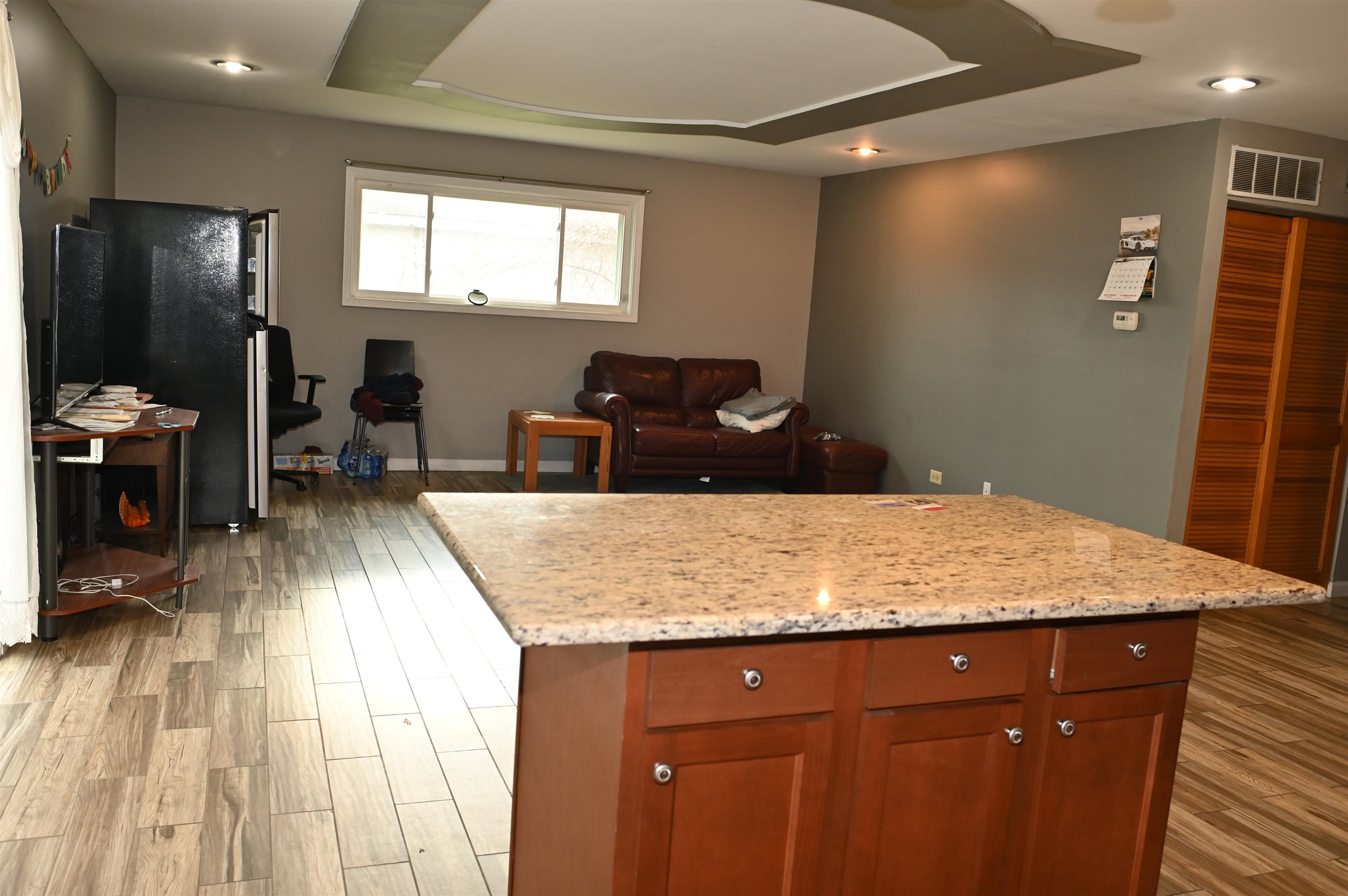 177 West Briarcliff Road Bolingbrook, IL 60440 - Photo 7 of 20 a kitchen with granite countertop sink cabinets and wooden floor