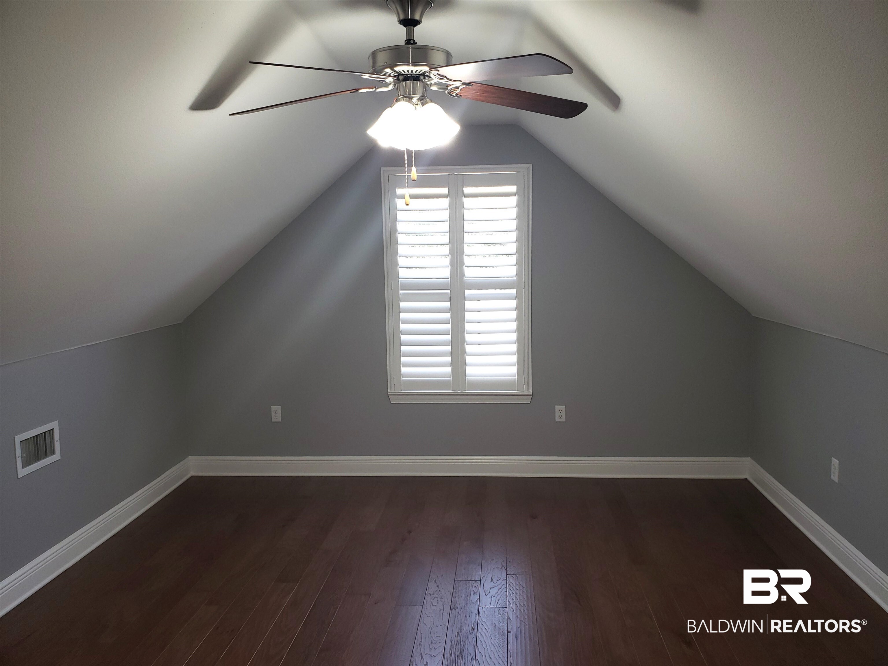23373 Dundee Circle Foley, AL 36535 - Photo 21 of 34 Bonus room with lofted ceiling, hardwood / wood-style flooring, and ceiling fan