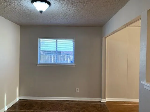 a kitchen with cabinets appliances and a window