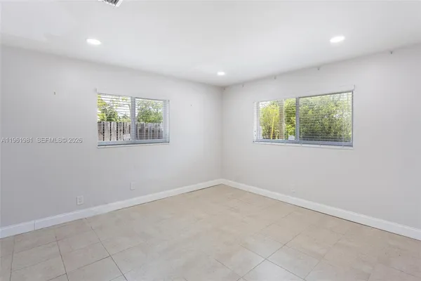 an empty room with windows