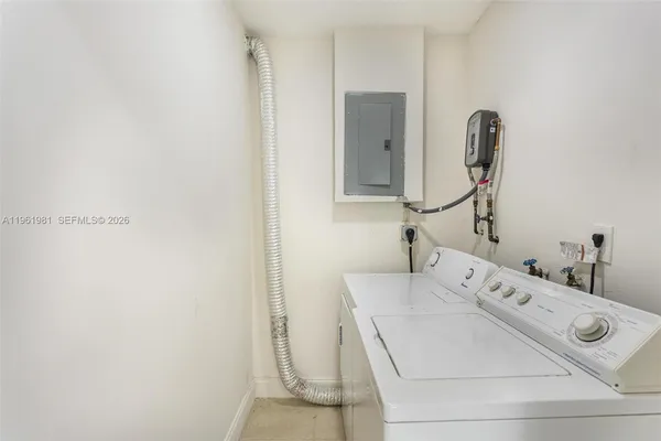a utility room with dryer and washer