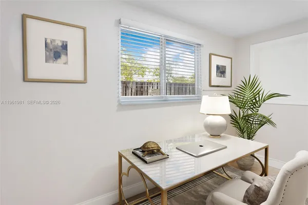 a living room with furniture and window