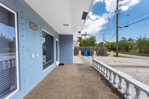 a view of a porch with a small yard