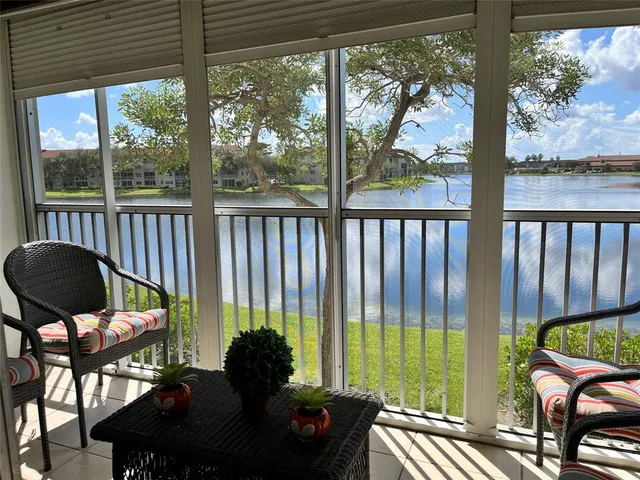 a living room filled with furniture and a yard